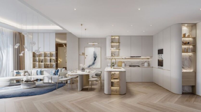 Cucina e soggiorno moderni nel Sunset Bay Grand Residence di Imtiaz a Dubai Islands, con toni chiari e neutri, tocchi di marmo, scaffali a muro, un comodo tavolo da pranzo rotondo, illuminazione elegante e ampie finestre con luce naturale.