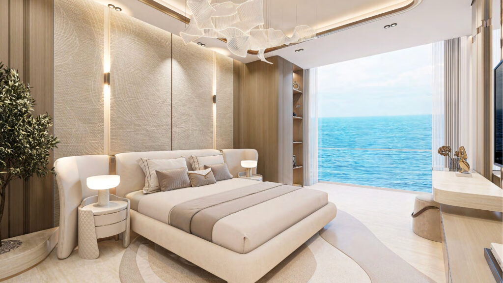 The modern, elegant bedroom in beige and cream tones at Breez by Danube Maritime City features a king-size bed, elegant lighting, floor-to-ceiling windows with ocean views, plus a desk, TV and potted plant for serene luxury.