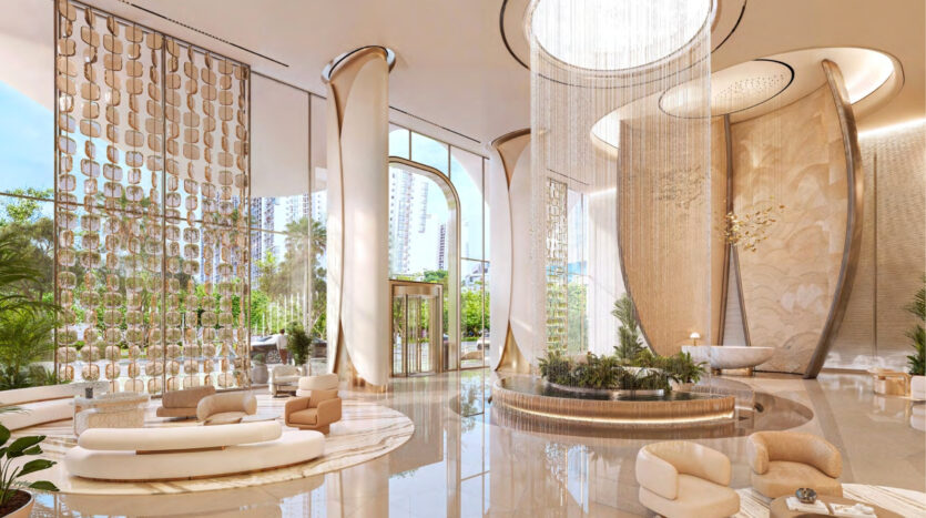 The luxurious lobby of the Breez by Danube Maritime City hotel features high ceilings, elegant curved seating, large windows, indoor plants and cascading light fixtures. Soft, neutral tones and flowing lines create a spacious, sophisticated atmosphere.