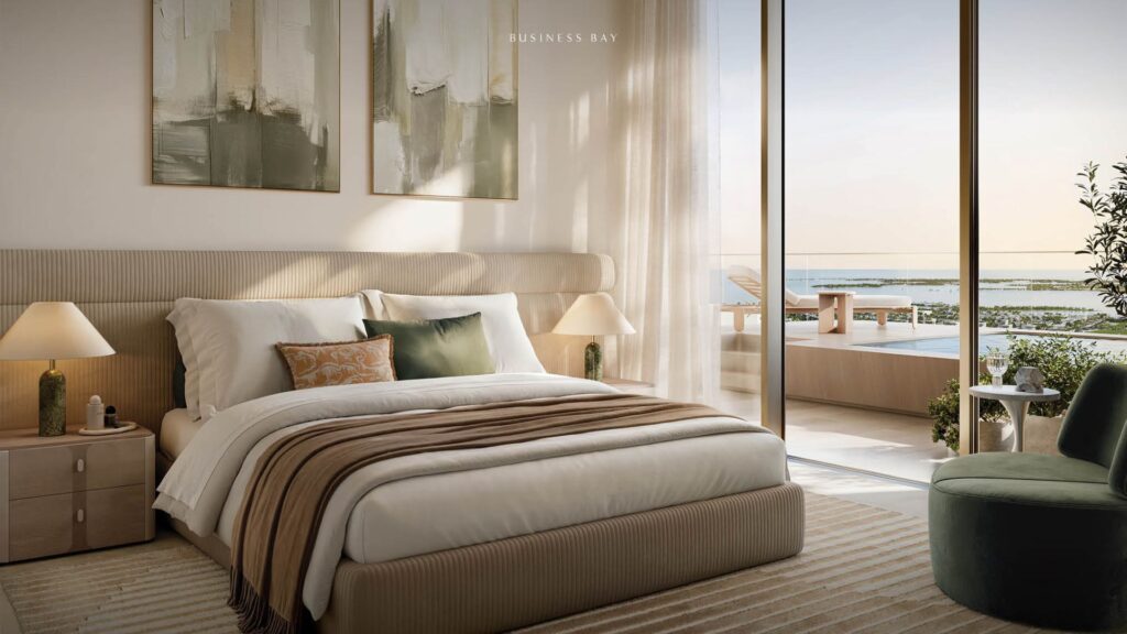 Modern bedroom from Avarra with a king-size bed, neutral bedding, elegant bedside tables and lamps, abstract artwork above the headboard and a floor-to-ceiling window overlooking a pool and water view. Sunlight fills the space.