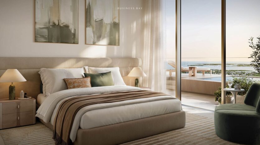 Modern bedroom from Avarra with a king-size bed, neutral bedding, elegant bedside tables and lamps, abstract artwork above the headboard and a floor-to-ceiling window overlooking a pool and water view. Sunlight fills the space.