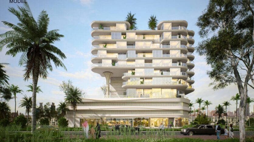 Modern multi-storey building with rounded balconies, large bay windows and greenery on every floor in the Rabdan gardens. Palm trees and people walking in front, with a car parked on the street. Clear sky with a few clouds in the background.