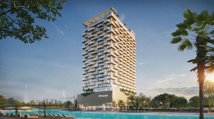 Il Caden è un moderno hotel a grattacielo con un design unico e geometrico dei balconi, situato accanto a una grande piscina circondata da palme e lettini, il tutto sotto un limpido cielo blu con lo skyline della città sullo sfondo.