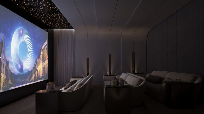 Scoprite il Caden: un home cinema di lusso, con divani di peluche, tavolini e un grande schermo che proietta una scena al chiaro di luna. Le luci stellari adornano il soffitto, mentre popcorn e bevande attendono i vostri ospiti sui tavoli.