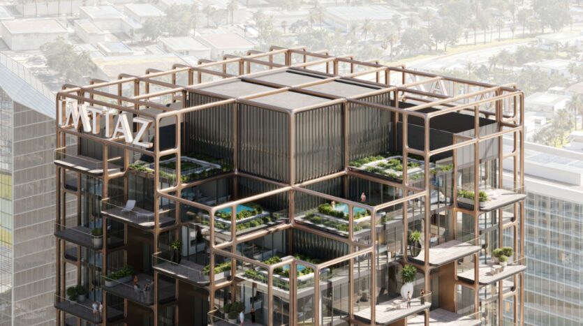 The Symphony is a modern tower characterized by an open geometric structure on the roof, multiple terraces with greenery and swimming pools, and bold "IMTIAZ" signage at the top, overlooking a bustling urban landscape.