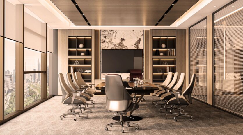 Modern meeting room with a long wooden table, ten desk chairs, built-in shelving with decoration, a large wall-mounted TV and floor-to-ceiling windows offering city views. The symphony of neutral tones creates an air of sophistication throughout the space.
