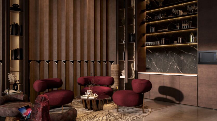 A modern living room with four burgundy armchairs around a wooden coffee table, set on a patterned rug. The Symphony plays softly in the background, complementing the dark marble shelves, warm lighting and tall brown paneled walls.