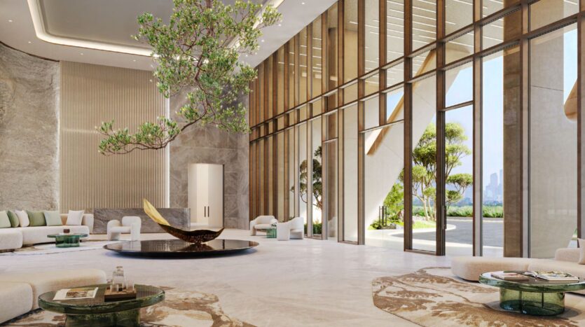 A spacious and modern entrance hall with high ceilings, large floor-to-ceiling windows, light marble floors, contemporary Hado furniture, a black round table with a sculptural centerpiece, and an indoor tree with green leaves.
