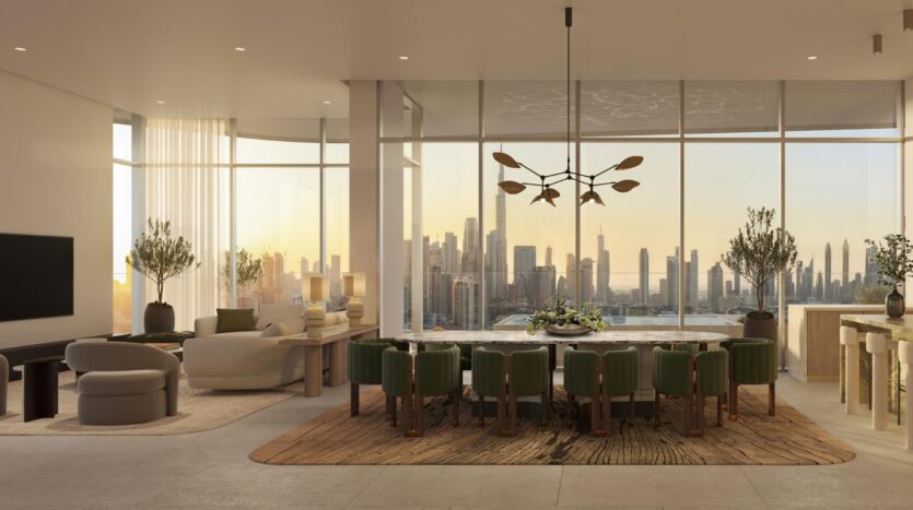 Modern and elegant living and dining room, open to the outside and featuring large windows offering breathtaking views of the city at sunset. The space includes green chairs, a marble dining table, comfortable seating, and décor that highlights the art throughout the space.