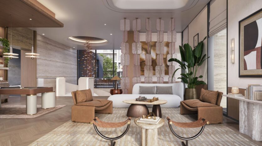 A modern hotel lobby with brown leather chairs, a white sofa, coffee tables, abstract art, a large potted plant, and decorative partitions, all in neutral tones, with plenty of natural light and stunning views of the Eltiera.