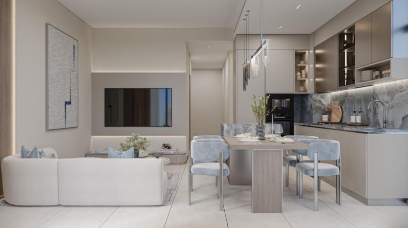 Modern open-plan living space with a light, neutral color palette, featuring a comfortable sofa, large wall-mounted TV, dining table with velvet Linea chairs, and stylish kitchen with marble backsplash and minimalist décor.