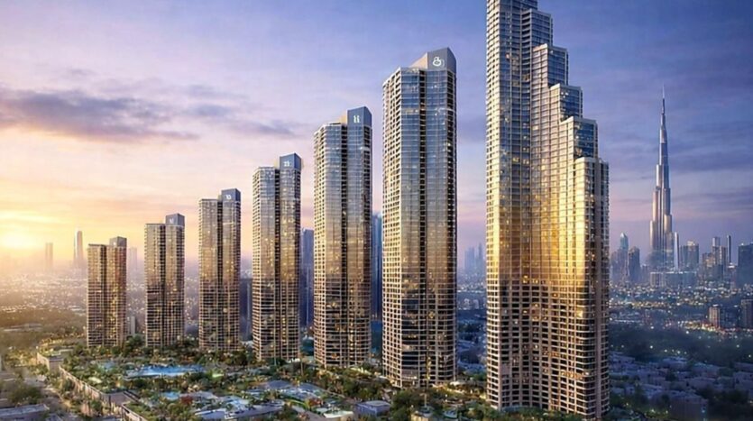 A row of tall modern skyscrapers with glass facades reflect the sunlight at sunset in the heart of Mercedes Benz City. The skyline consists of high-rise buildings, with the iconic Burj Khalifa in the background and greenery below.