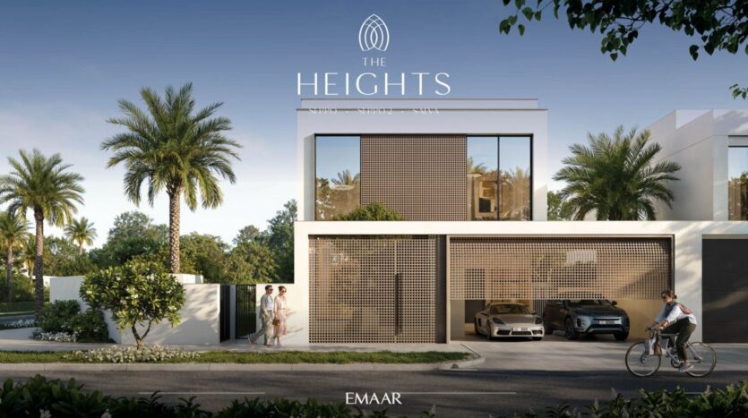 Modern two-story villa with palm trees and luxury cars in the driveway. Two people stand near the entrance while another rides by on a bicycle. The text "The Heights" highlights this exclusive destination, with "EMAAR" at the bottom.