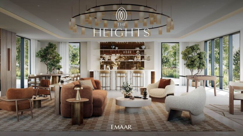 Modern and luxurious lounge with stylish sofas and armchairs, a central coffee table, large windows overlooking greenery, elegant lighting, and a chic bar at the back. The name "The Heights" is displayed at the top.