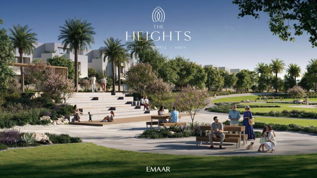 A landscaped park with palm trees, gardens, and people relaxing on benches and steps in The Heights. Modern buildings rise in the background. The text reads "The Heights, EMAAR, Expo 2 - SANAA."