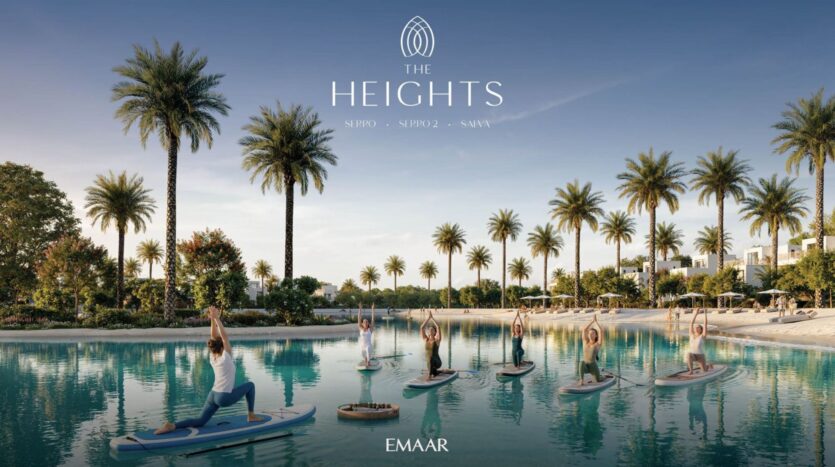 A group practices yoga on paddleboards in a calm tropical lagoon, surrounded by palm trees and modern villas, with The Heights and Emaar logos displayed above. Experience wellness and serenity in the heart of The Heights.