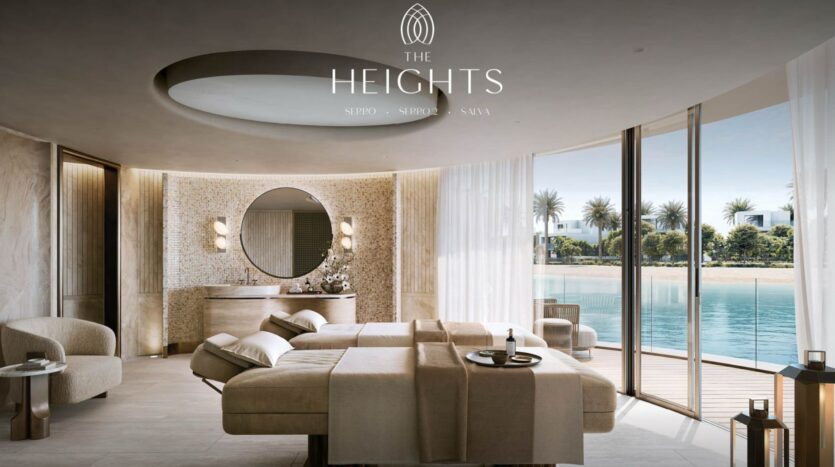 Luxurious spa room equipped with massage tables, soft lighting, and modern décor. Large windows offer peaceful views of the pool and palm trees, reflecting the serene atmosphere of The Heights. The logo and text "The Heights" appear at the top of the image.