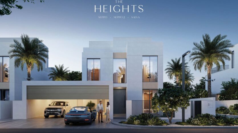 A modern white two-story villa with large windows, a garage, and two cars parked in front. Three people are standing near the entrance. Palm trees and greenery surround The Heights property under a clear sky. The text reads "The Heights."