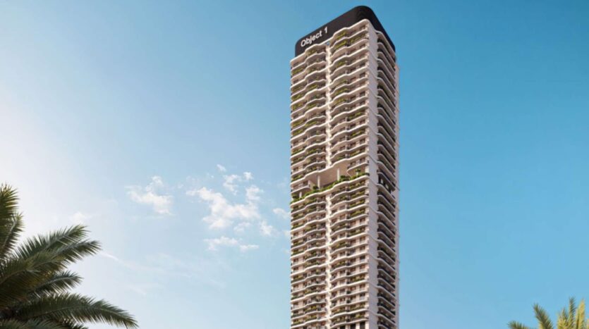 A large modern building with numerous balconies stands out against a clear blue sky. The name "Alta View" appears at the top of the building. Palm leaves are visible in the lower left corner.