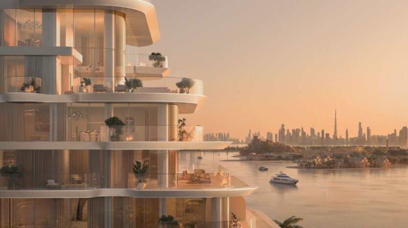 The luxury apartments in the Bella by Passo tower feature curved balconies overlooking calm waters, yachts, and the silhouette of a city at sunset, with the Burj Khalifa in the distance. The scene radiates warmth and serenity under soft, golden lighting.