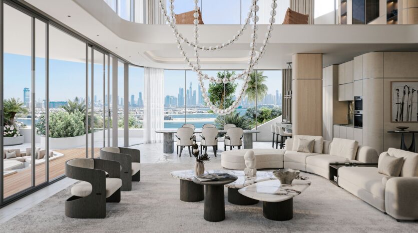 The modern and spacious living room at Bella by Passo features floor-to-ceiling windows, light-colored furniture, marble tables, impressive chandeliers, and views of the city. An open dining room and outdoor terrace are visible.