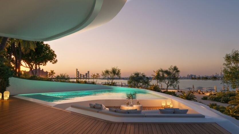 Discover Bella by Passo: a luxurious terrace with sunken seating and a pool overlooking the water at sunset, the city skyline, and lush greenery. Modern, elegant architecture combines with a peaceful outdoor atmosphere for the perfect getaway.