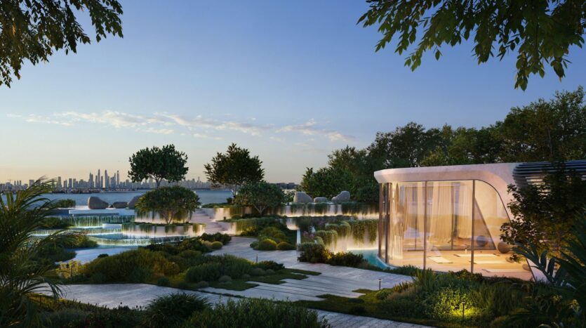 The modern glass building, Bella by Passo, features curved architecture that overlooks landscaped gardens, swimming pools, and lush greenery at sunset, with the distant city skyline visible under clear skies.