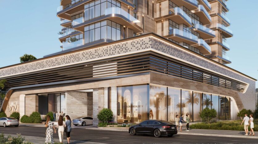 Modern luxury building in Flora Bay with large bay windows and balconies, sleek architectural details, and several people walking outside near parked cars on a sunny day.