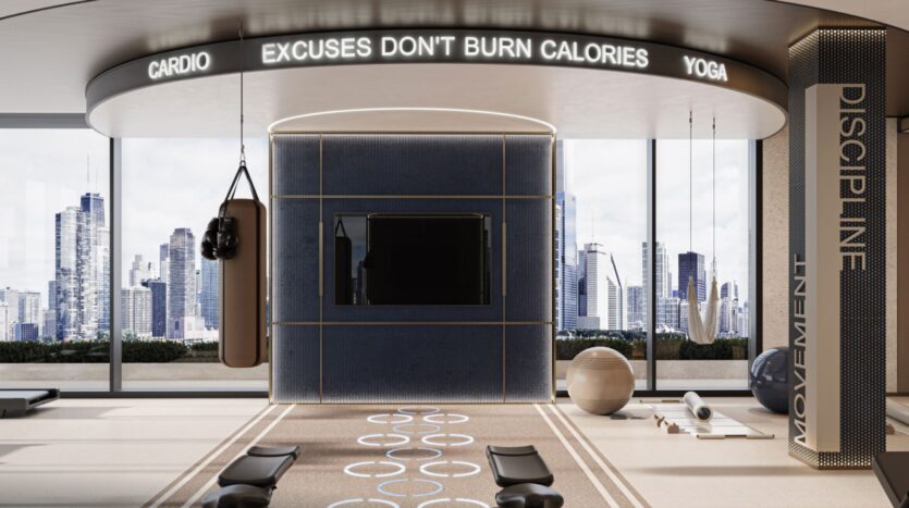 The Inara residence's modern gym features a punching bag, yoga mats, exercise balls, and large windows overlooking the city skyline. A lighted sign reads "Excuses don't burn calories," while the words "Discipline" and "Movement" are displayed on a pillar.