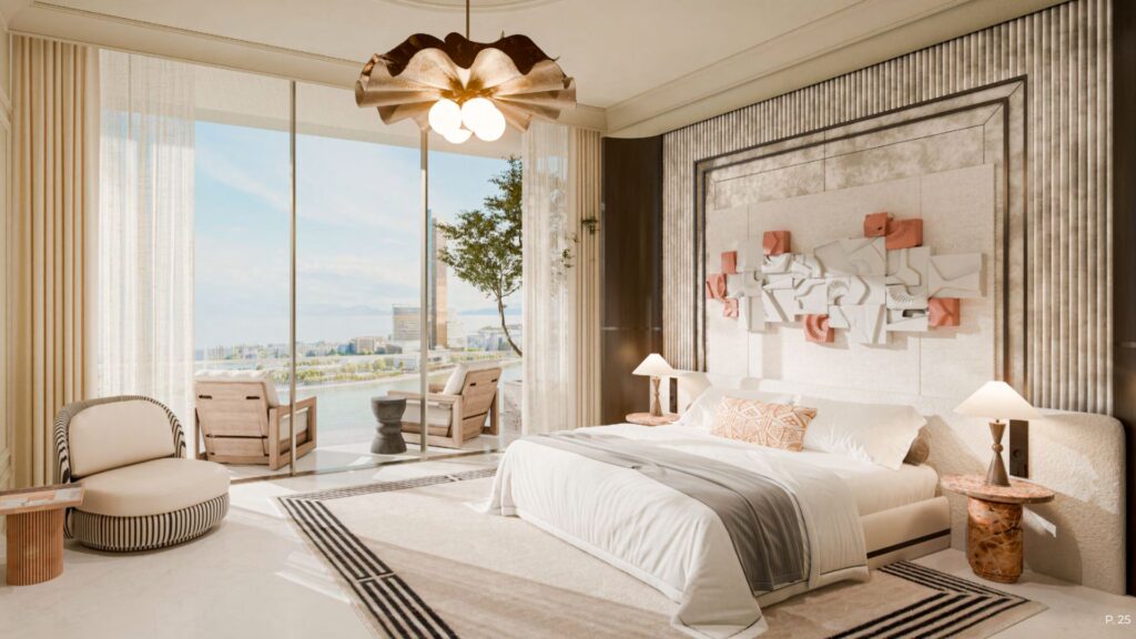 La chambre moderne et lumineuse du Château est dotée d'un grand lit, d'un décor neutre, d'œuvres d'art murales abstraites, d'un mobilier en bois clair et de fenêtres allant du sol au plafond et s'ouvrant sur un balcon avec vue sur l'eau et des sièges extérieurs.