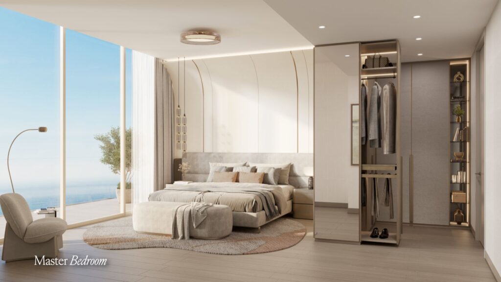 The modern master bedroom of the Meriva features a large bed, neutral tones, floor-to-ceiling windows with sea views, an armchair with a lamp, and an open wardrobe with mirrored doors.