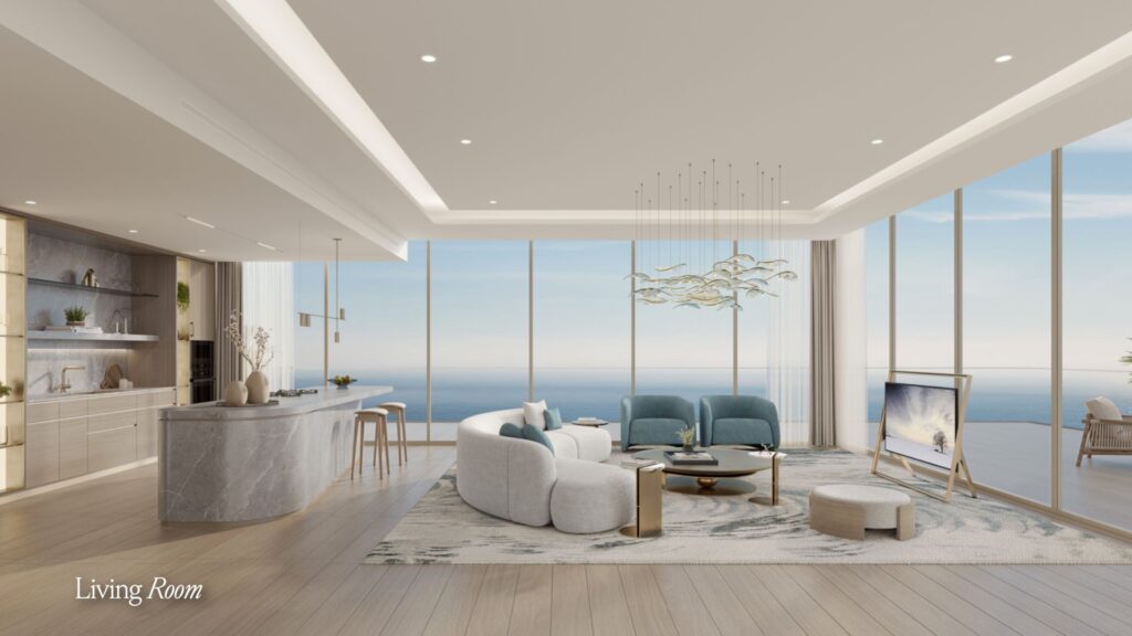 A modern and spacious living room with floor-to-ceiling windows overlooking the ocean, featuring a curved Meriva sofa, light blue chairs, a marble kitchen island, and minimalist decor in neutral tones.