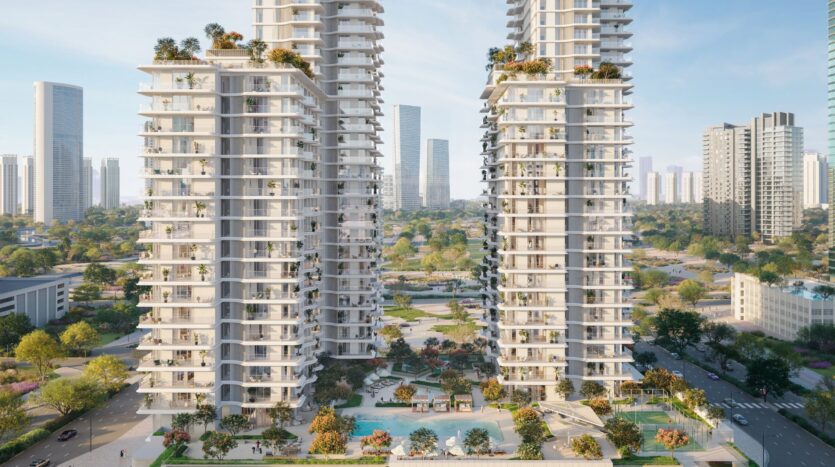 Two modern residential towers in Muheira, featuring large balconies and green roofs, surround a landscaped courtyard with a swimming pool, set in a vibrant urban landscape of tall buildings and abundant greenery.