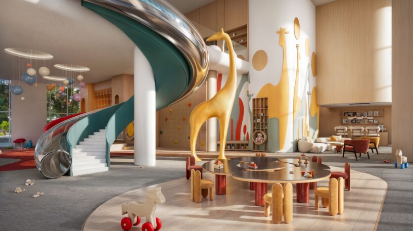 Muheira's modern and spacious children's playroom features a spiral slide, round tables with small chairs, large giraffe sculptures, a rocking horse, wall art, and playful décor in a bright and welcoming atmosphere.