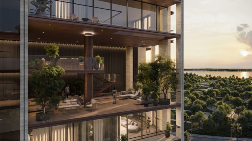 A modern multi-story apartment in Sea Cliff with floor-to-ceiling windows, spacious balconies filled with greenery, and people enjoying life indoors and outdoors, overlooking lush scenery and the water at sunset.