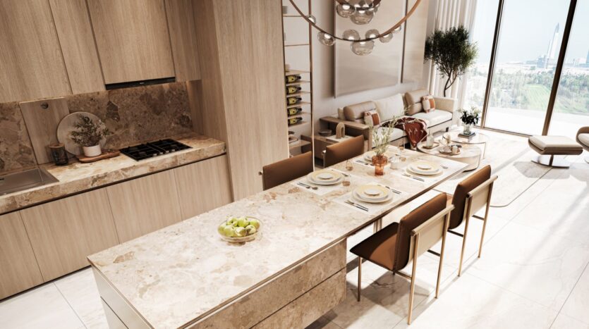 A modern kitchen and dining room in Sea Cliff feature light marble countertops, wood cabinets, a dining table that seats six, and large windows offering unobstructed views of the greenery. A comfortable living area is visible in the background.