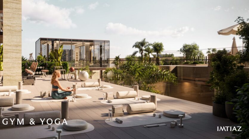 A woman practices yoga on a spacious, modern outdoor terrace in Sea Cliff, with yoga mats and equipment, surrounded by lush greenery and a view of the city. The text reads "GYM &amp; YOGA" and "IMTIAZ" in the corners.