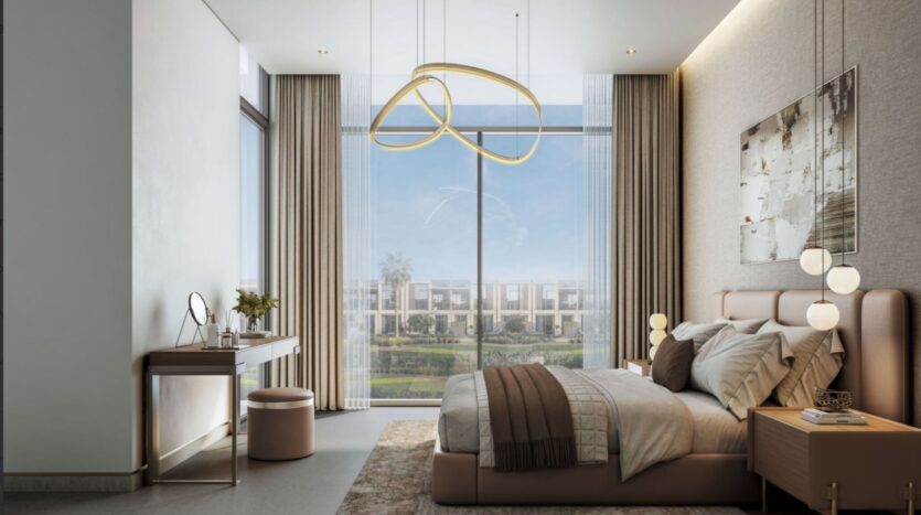 Modern bedroom at Sobha Sanctuary with a large bed, nightstand, and stylish lighting. Floor-to-ceiling windows reveal the greenery and villas outside. A dressing table and neutral tones create a calm and elegant atmosphere.