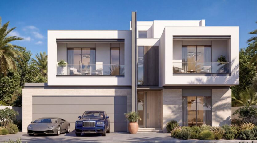 A modern two-story house in Sobha Sanctuary, with large windows and balconies, flanked by palm trees and lush landscaping. Two luxury cars, one gray and one blue, are parked in the driveway on a sunny day.