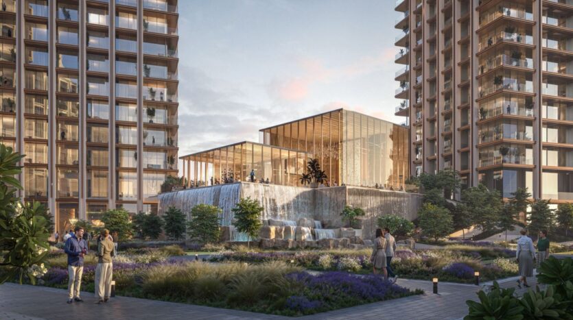 Современный внутренний двор в The Residences DIFC включает в себя роскошные сады, прогулочные дорожки и два больших жилых здания, окружающих стеклянную конструкцию с каскадами в центре.