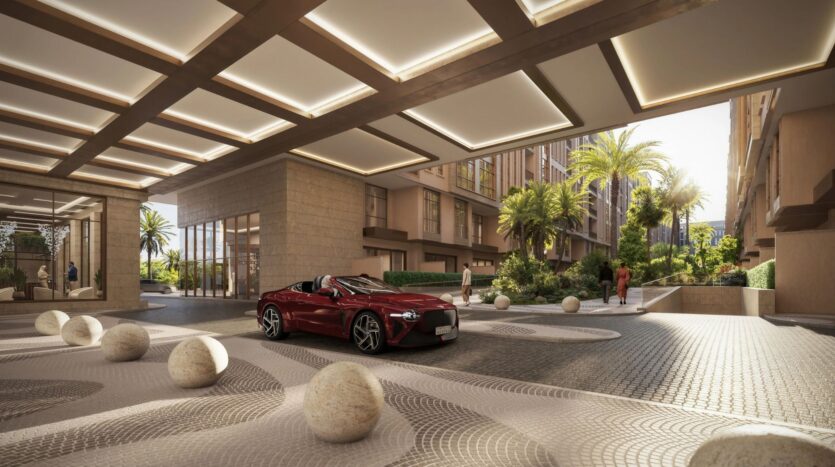 Une allée luxueuse du Trump Plaza présente une décapotable rouge sous un auvent moderne et géométrique. Des sphères en pierre accentuent le revêtement à motifs, tandis qu'une verdure luxuriante et de grands palmiers encadrent l'entrée du bâtiment haut de gamme.