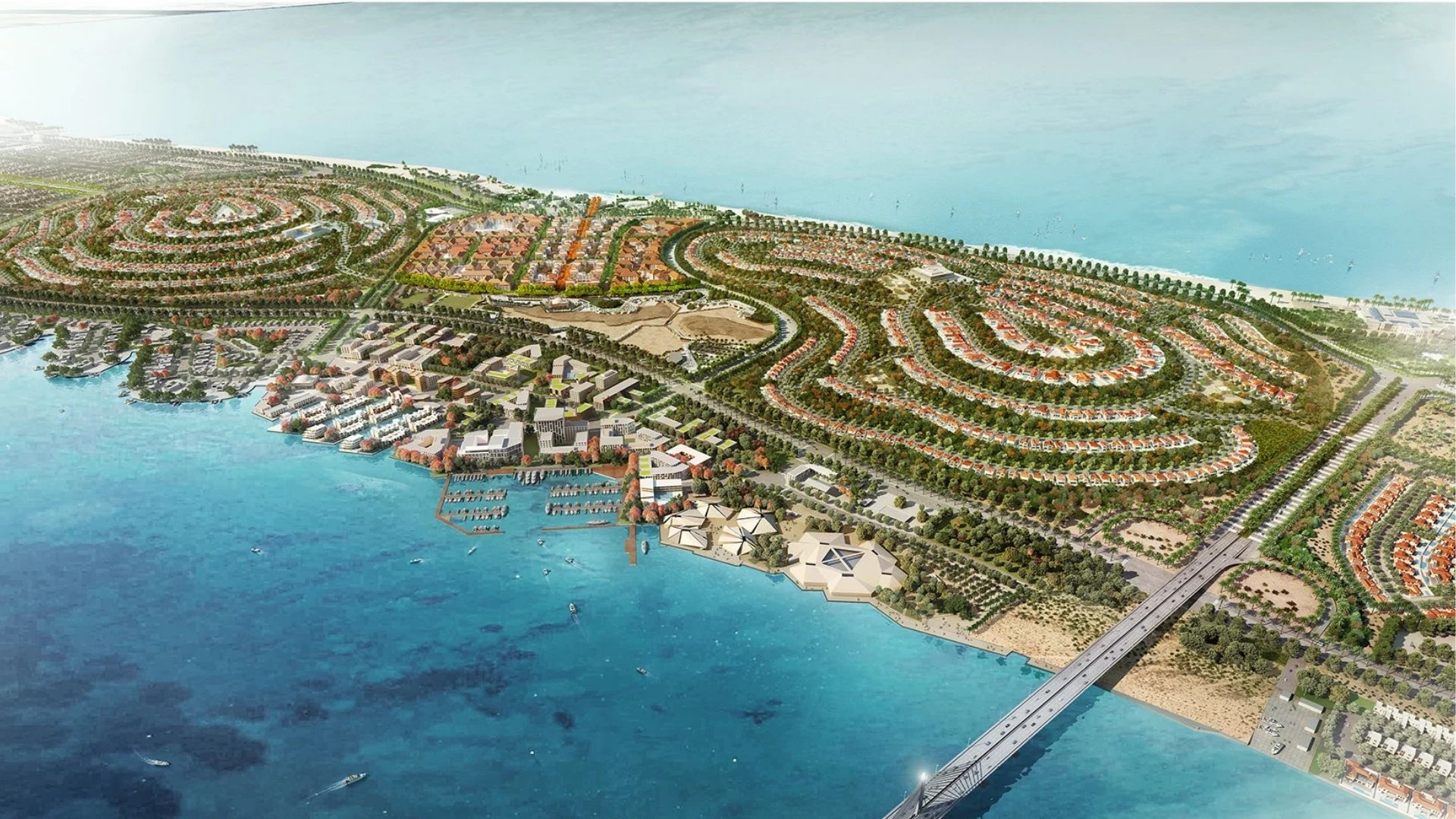 Aerial view of a coastal city with winding roads, seaside buildings, and marinas—reflecting the vision of Modon, a real estate developer in Abu Dhabi—where green spaces and a bridge connect vibrant residential and commercial areas by the sea.