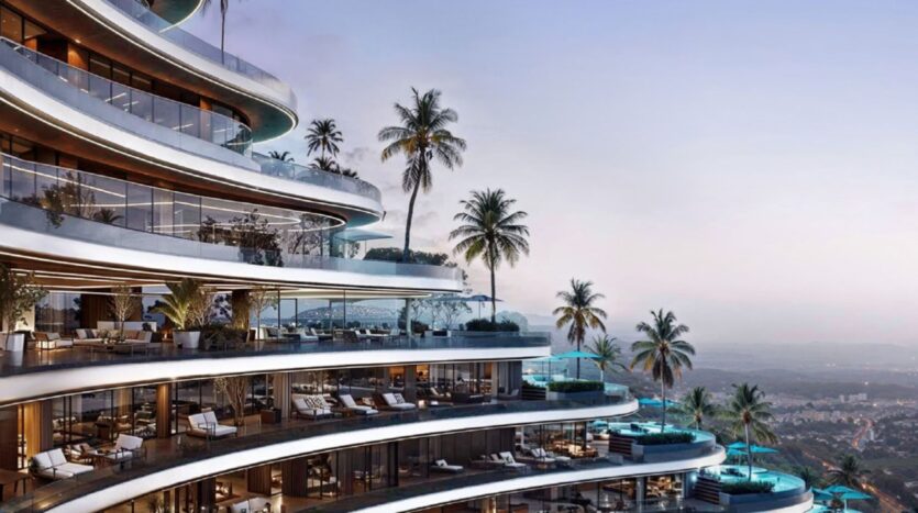 Skyflame, a modern luxury high-rise featuring curved balconies, palm trees, outdoor seating, and swimming pools, overlooks a picturesque landscape at sunset.
