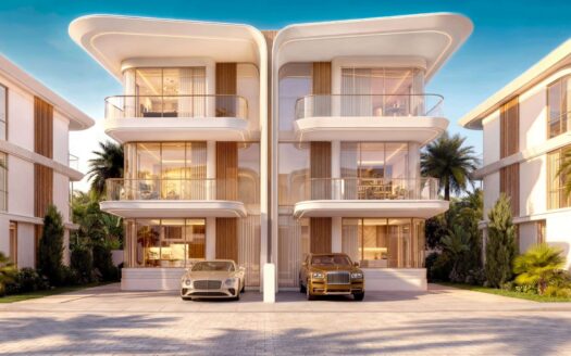 Las dos modernas villas de lujo de tres plantas de Greenz by Danube cuentan con balcones curvos y grandes ventanales, y cada una tiene un coche de lujo aparcado en la entrada. Las palmeras y la exuberante vegetación rodean los edificios bajo un cielo azul cristalino.