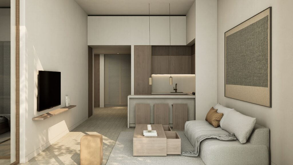 The minimalist living room features light wood furniture, a wall-mounted TV, a beige sofa with beige cushions, a simple coffee table, and a kitchen with wood cabinets and bar stools for breakfast. The JAD288 harmoniously blends styles in an open space.