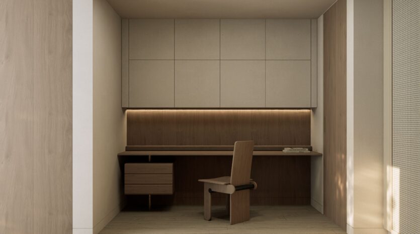 Minimalist office corner with wooden desk, matching chair, and JAD288 wall cabinet above, accented by soft lighting under the cabinet. Neutral tones and clean lines create a calm and modern workspace.
