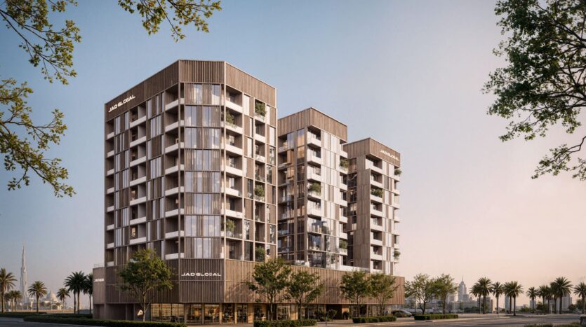 Modern mid-rise apartment building, JAD288, with large windows, balconies, and a wooden facade, surrounded by trees and palm trees on clear days. The structure has three sections and is located in an urban environment.