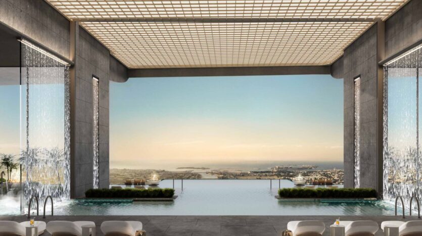 La lujosa piscina cubierta con efecto de rebosadero de las residencias Amali cuenta con cascadas en la entrada y ofrece unas vistas pintorescas de la ciudad y la costa. El espacio está rodeado de modernas tumbonas, y su techo abierto está decorado con un llamativo diseño en forma de rejilla.
