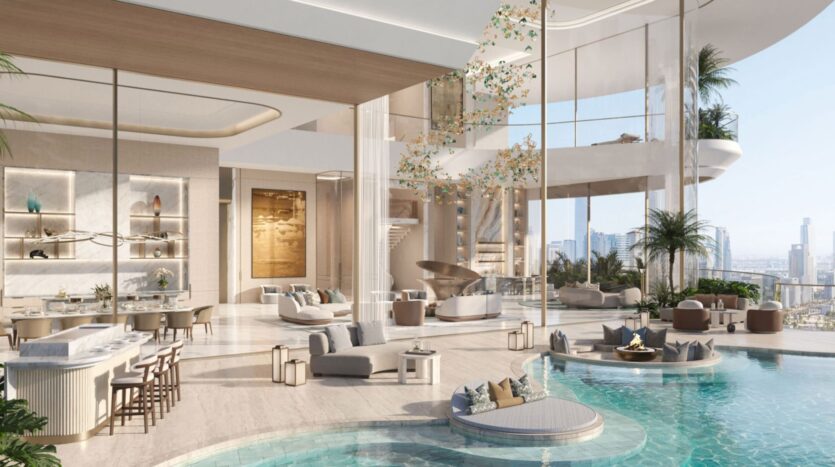 Descubra el lujoso salón diáfano de Amali Residences, equipado con mobiliario moderno, una piscina interior circular, ventanales con vistas a la ciudad, una decoración contemporánea, exuberantes plantas y una iluminación elegante en un entorno luminoso y espacioso.