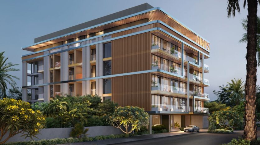 Derby Heights is a modern, mid-sized apartment building featuring large glass balconies, a wood-and-metal exterior, lush landscaping, and a car parked out front, captured at dusk with lights glowing inside.